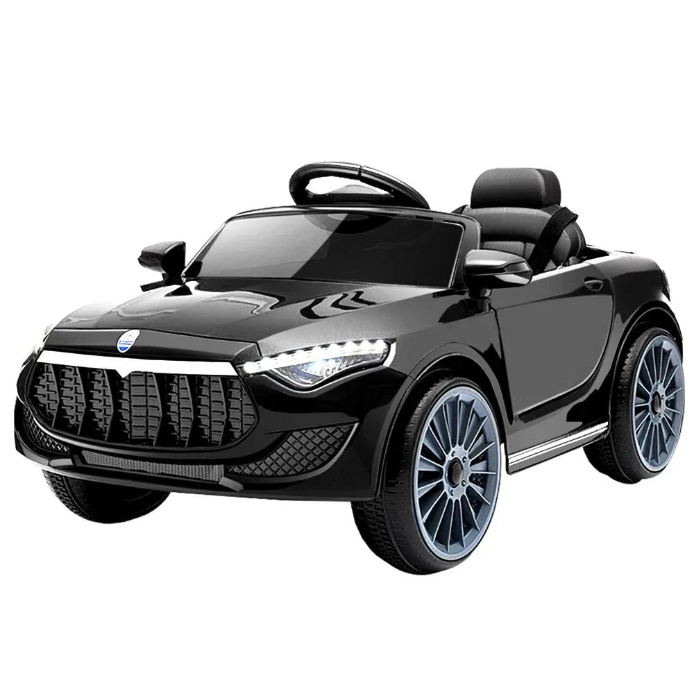 Front view of black electric kids ride-on car with sleek design and headlights on.
