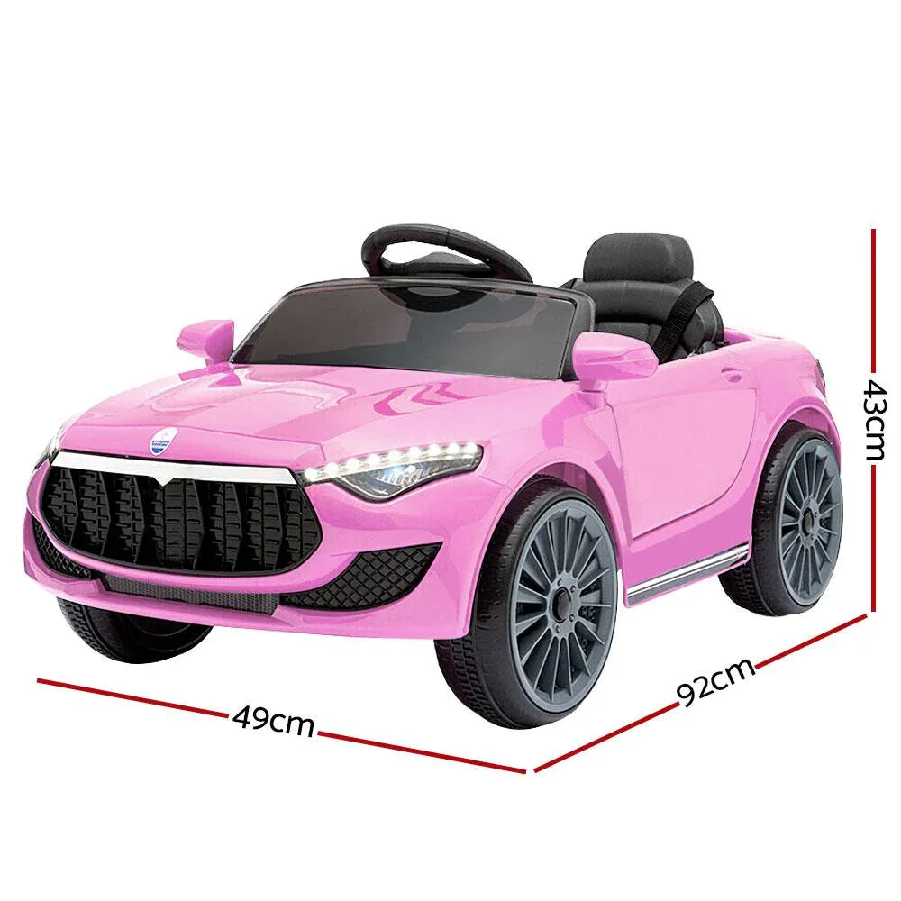 Side profile of pink ride-on car highlighting detailed wheels and doors.