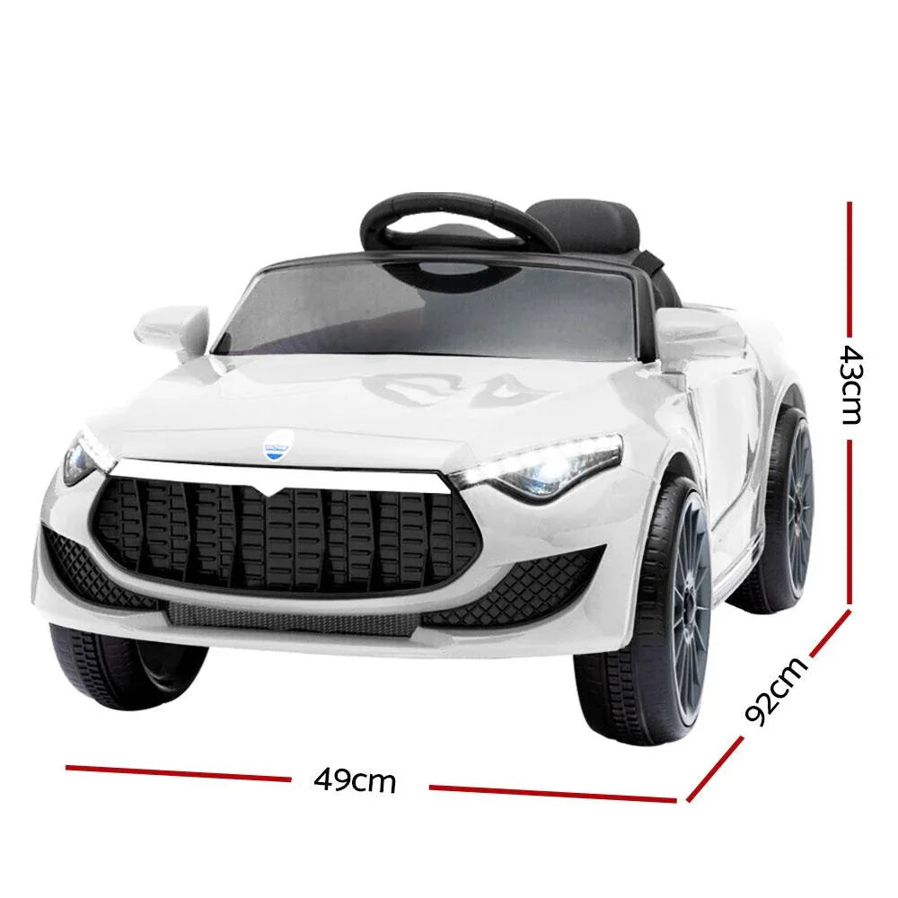 Closer angle of white kids' ride on car showing steering wheel and seat details.