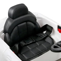 Interior shot of kids ride on car featuring detailed dashboard and steering wheel.