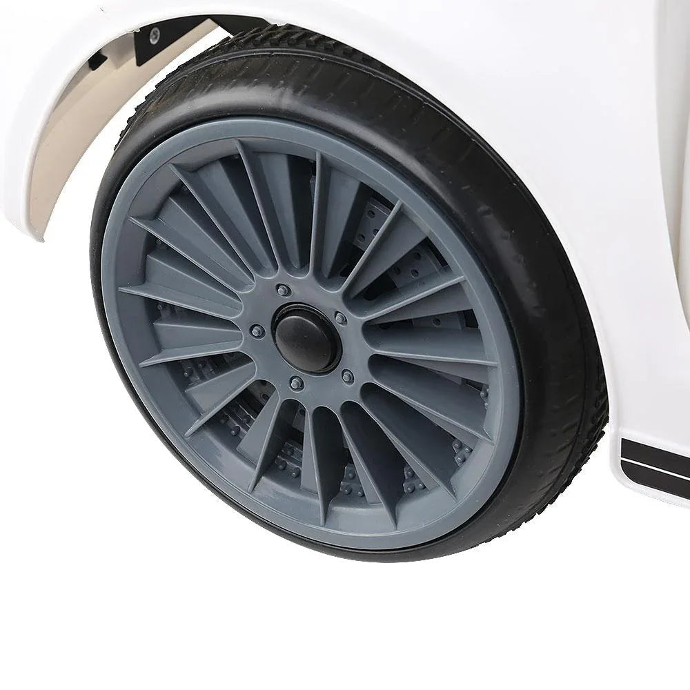 Close up of the wheels and suspension of white children's electric ride on car.