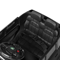 Rear view of black kids electric ride-on car showing taillights and solid frame.