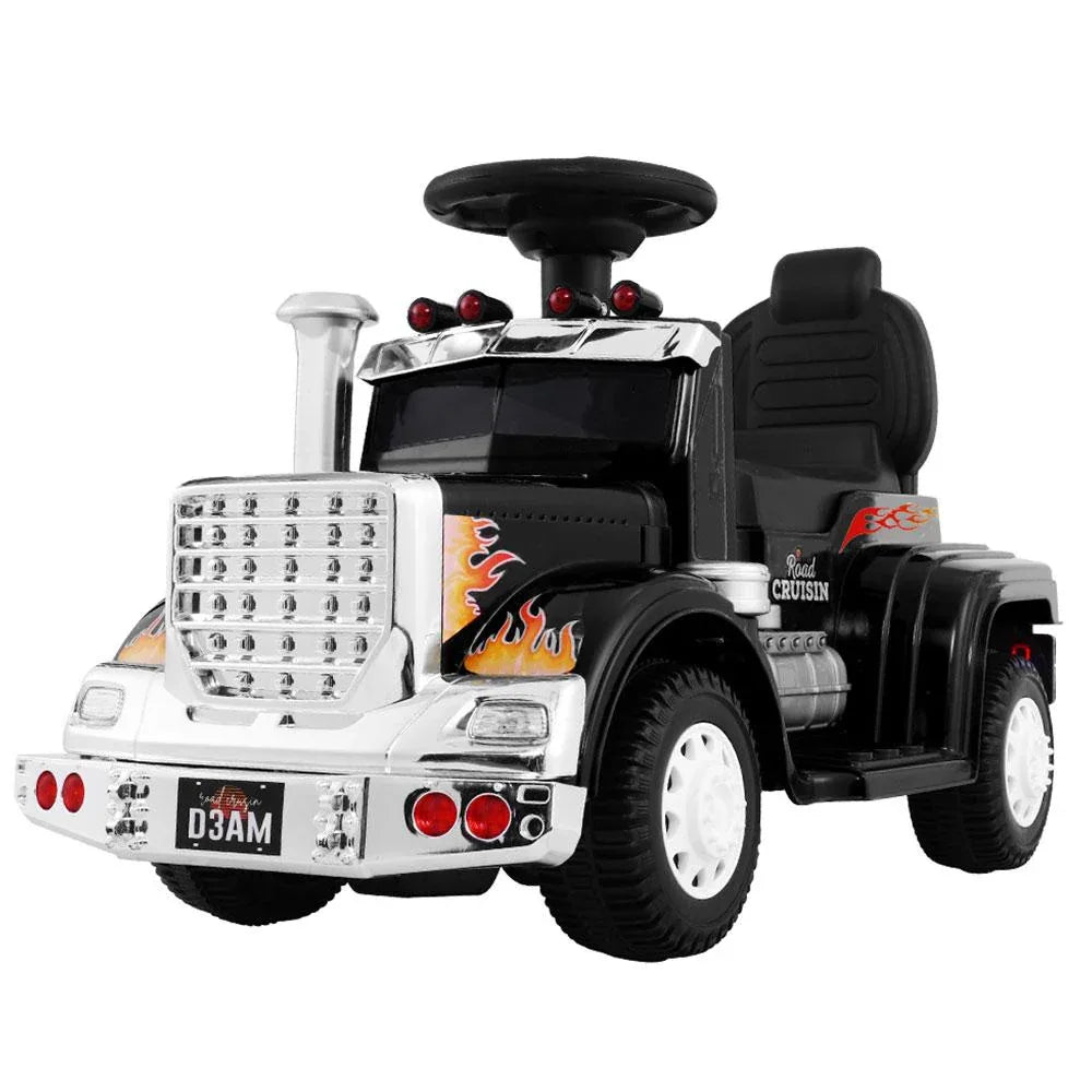 Black electric ride-on toy truck for kids, front-side view showing headlights and steering wheel.