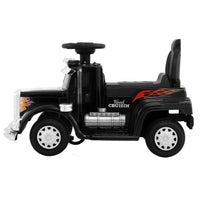 Rear-side view of black ride-on electric toy truck showcasing taillights and rear design.