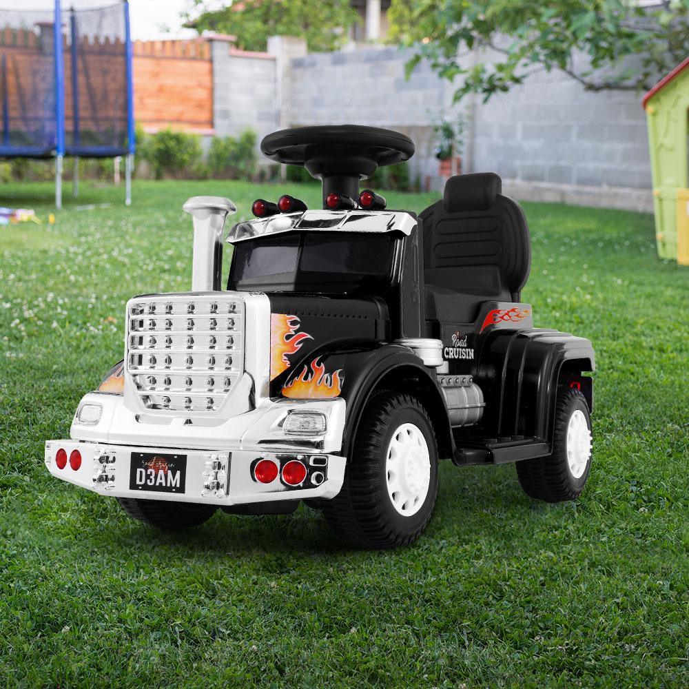 Close-up of textured black tire on kids’ electric ride-on toy truck.