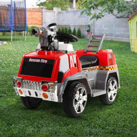 Close view of kids red and grey ride-on fire truck motorbike with visible wheels and footrests.