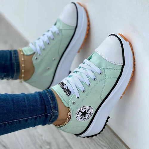 Snagva Flat Lace-Up Canvas Sneakers – close-up of canvas fabric and laces