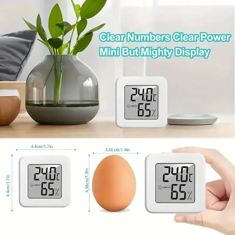 Close-up of bedroom temperature and humidity meter displaying current temperature and humidity levels.