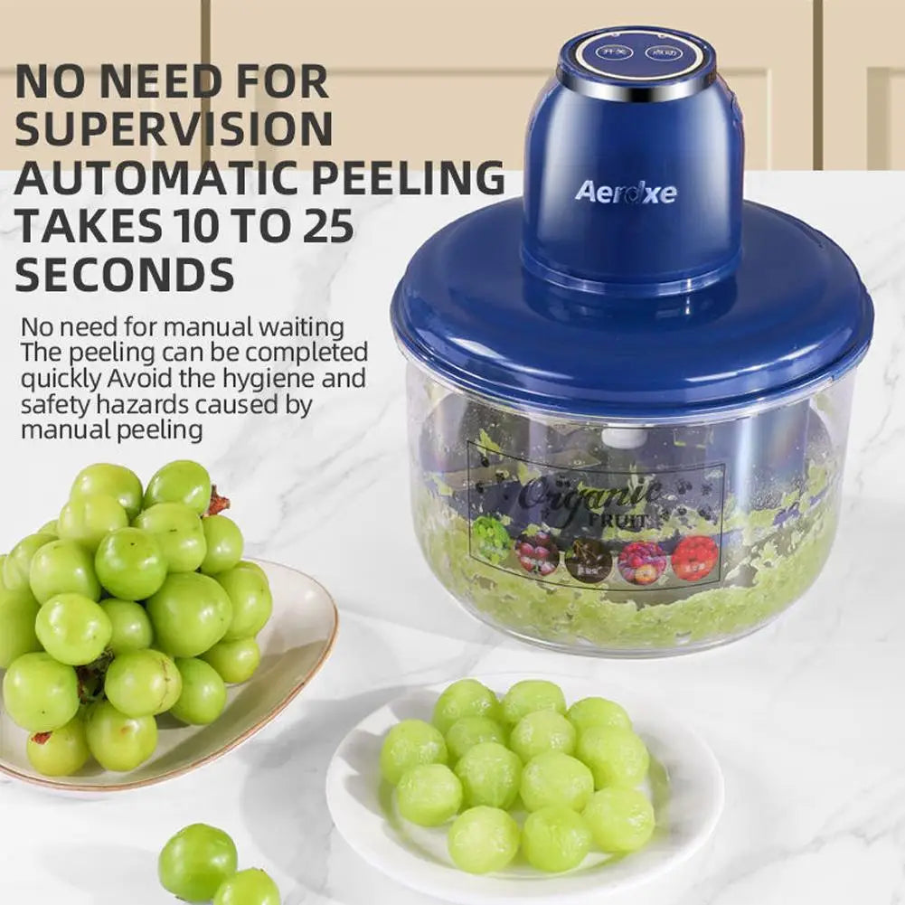 Compact electric fruit peeler on kitchen counter with peeled grape beside it.