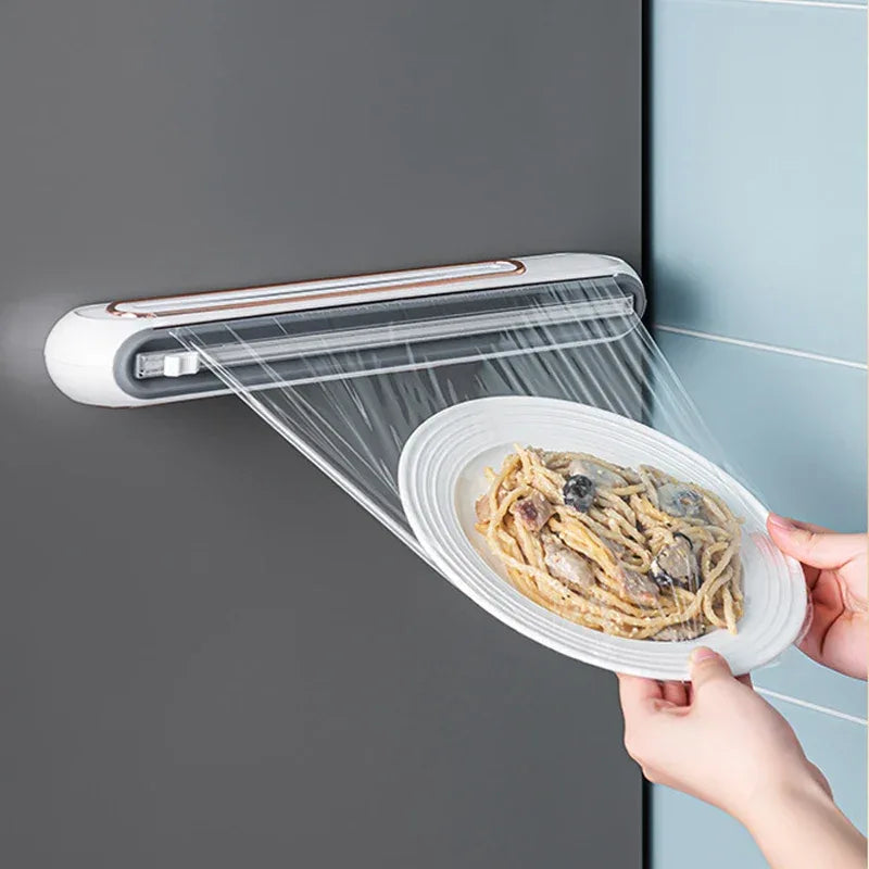 Close-up of two-way sliding blade cutter on magnetic plastic wrap dispenser