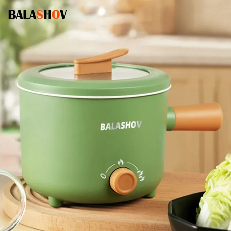 Multi cooker electric pot with non-stick pan and glass lid on a kitchen counter.