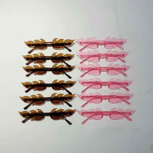 Set of 12 colorful, flame-shaped sunglasses with gradient lenses, displayed in a row on a white background.