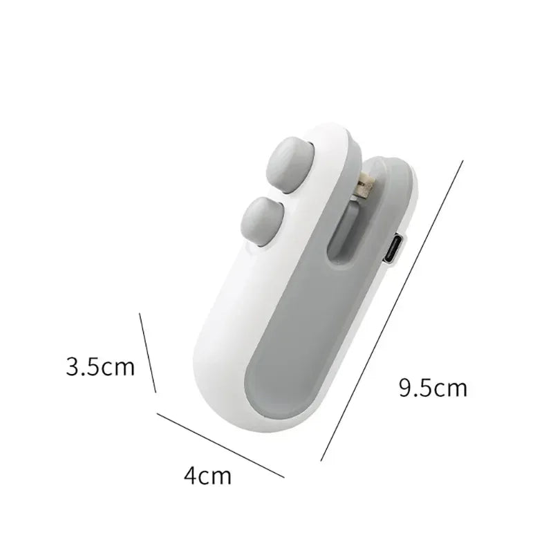 White portable heat sealer held in hand demonstrating lightweight and compact size.