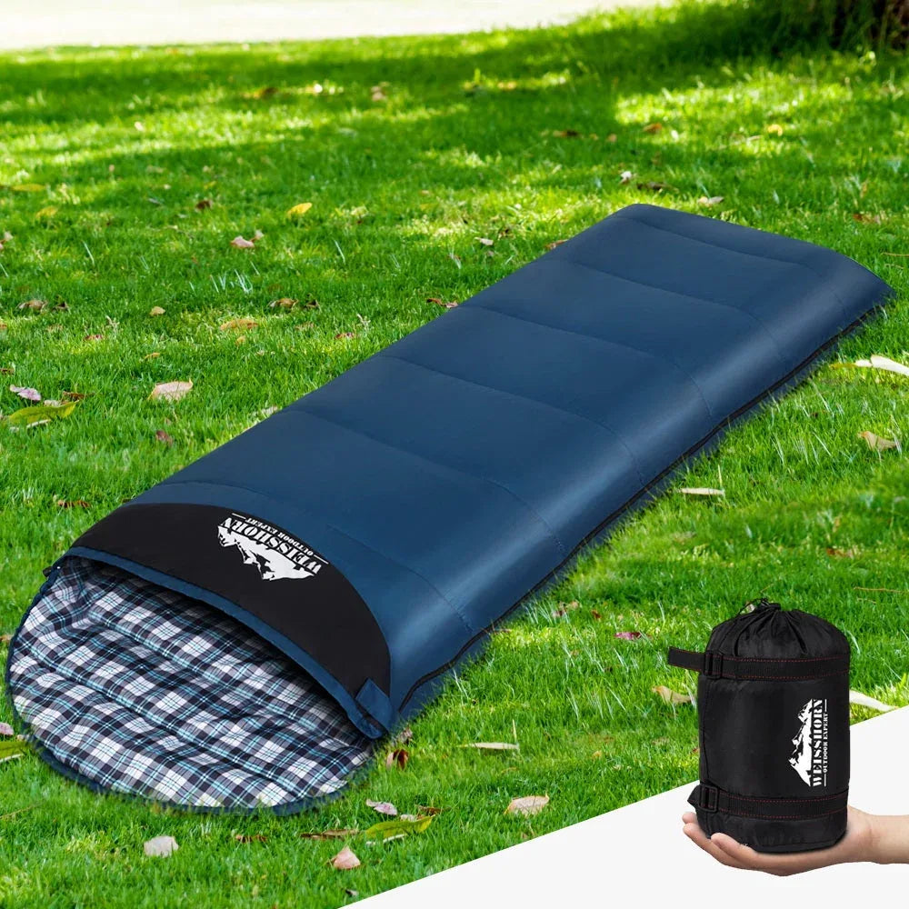 Weisshorn sleeping bag packed tightly in its reusable storage bag for easy transport.