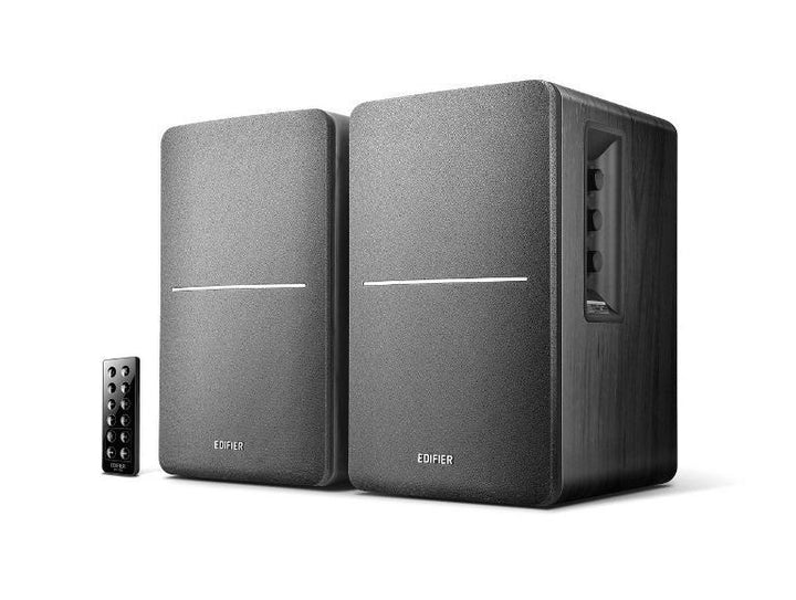 Black EDIFIER R1280DB Bluetooth bookshelf speakers with front dials and wood finish side panels