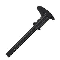 A small plastic digital caliper with a clear display, used for precise measuring in woodworking projects.