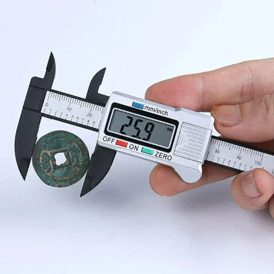 Plastic digital caliper with 150mm measuring range on white background.