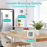 Small indoor temperature and humidity device with sleek black frame and easy-to-read digital display.