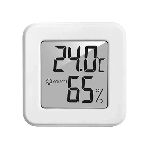 Indoor mini temperature and humidity meter displaying numbers clearly on a backlit screen.