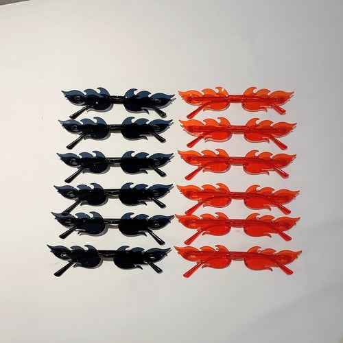 A set of twelve colorful flame-shaped sunglasses with gradient lenses arranged neatly on a white background.
