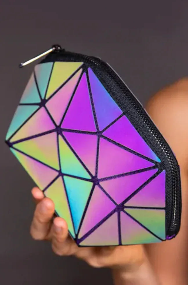 The bag being held in a hand, demonstrating compact size and vibrant holographic reflection.