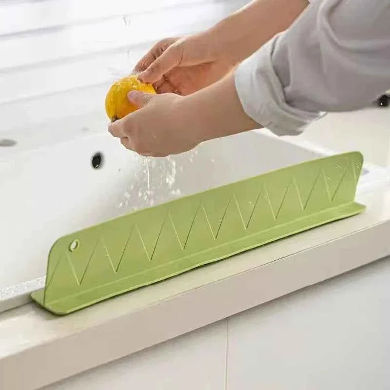Flexible silicone sink splash guard with suction cups, designed to prevent water from splashing outside the sink.
