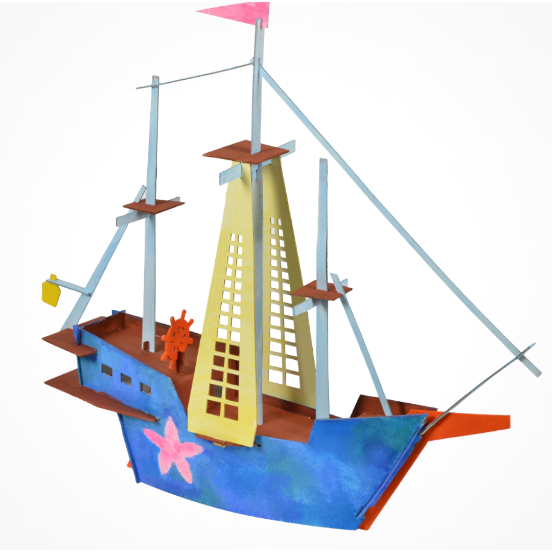 Side view of assembled cardboard ship model highlighting the sails and structure.