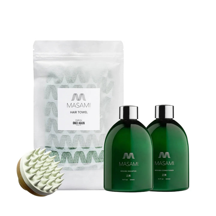 MASAMI Everything Shower Bundle with hydrating shampoo, conditioner, towel, and scalp scrubber on white background