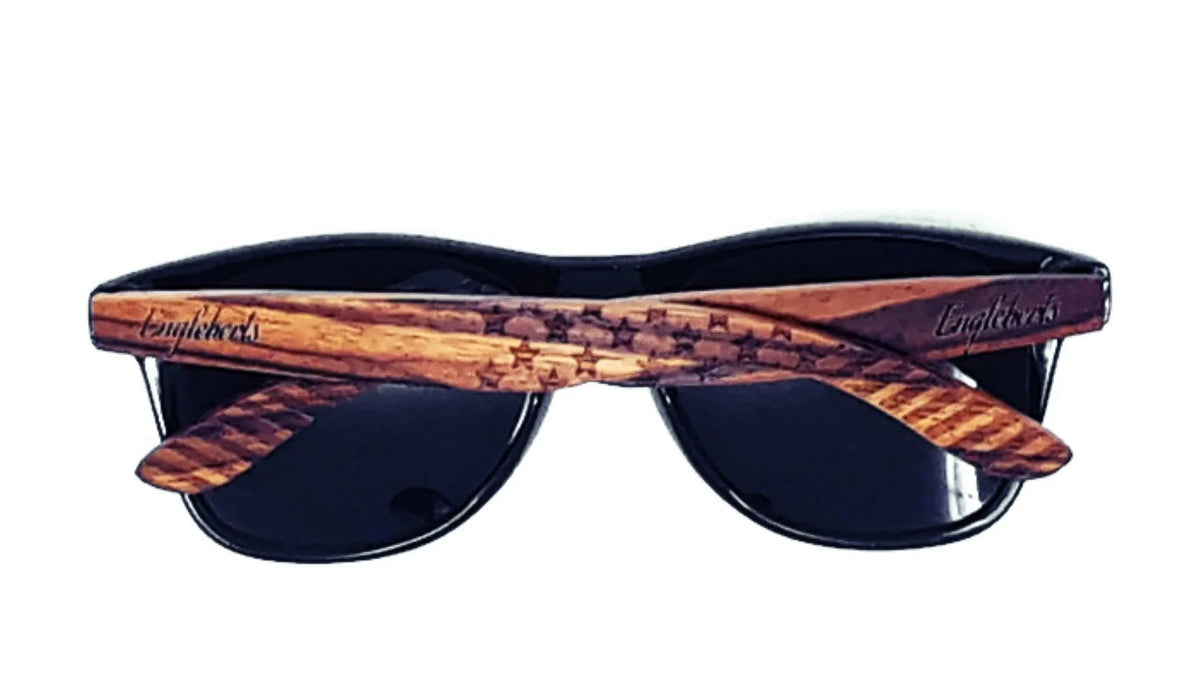 Back view showing engraved stars and stripes pattern on wooden frame of sunglasses