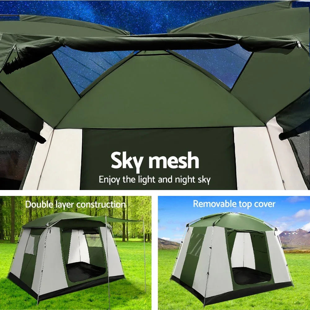 User setting up the Weisshorn instant pop-up tent on green grass surrounded by trees.