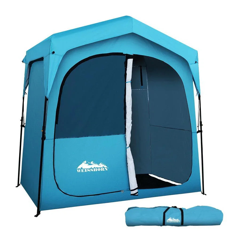 Weisshorn pop-up camping shower tent set up outdoors on grass, showing its full square shape and grey fabric.