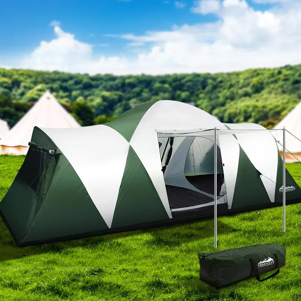 Wide shot of large Weisshorn dome tent in natural outdoor setting under a clear sky.