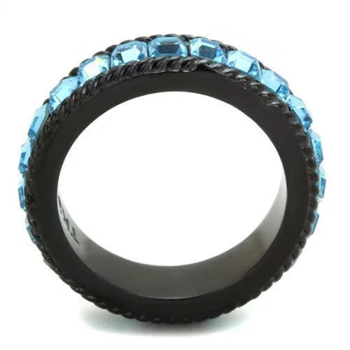 Ring displayed flat showing smooth black ion plating and sparkling sea blue crystal in center.