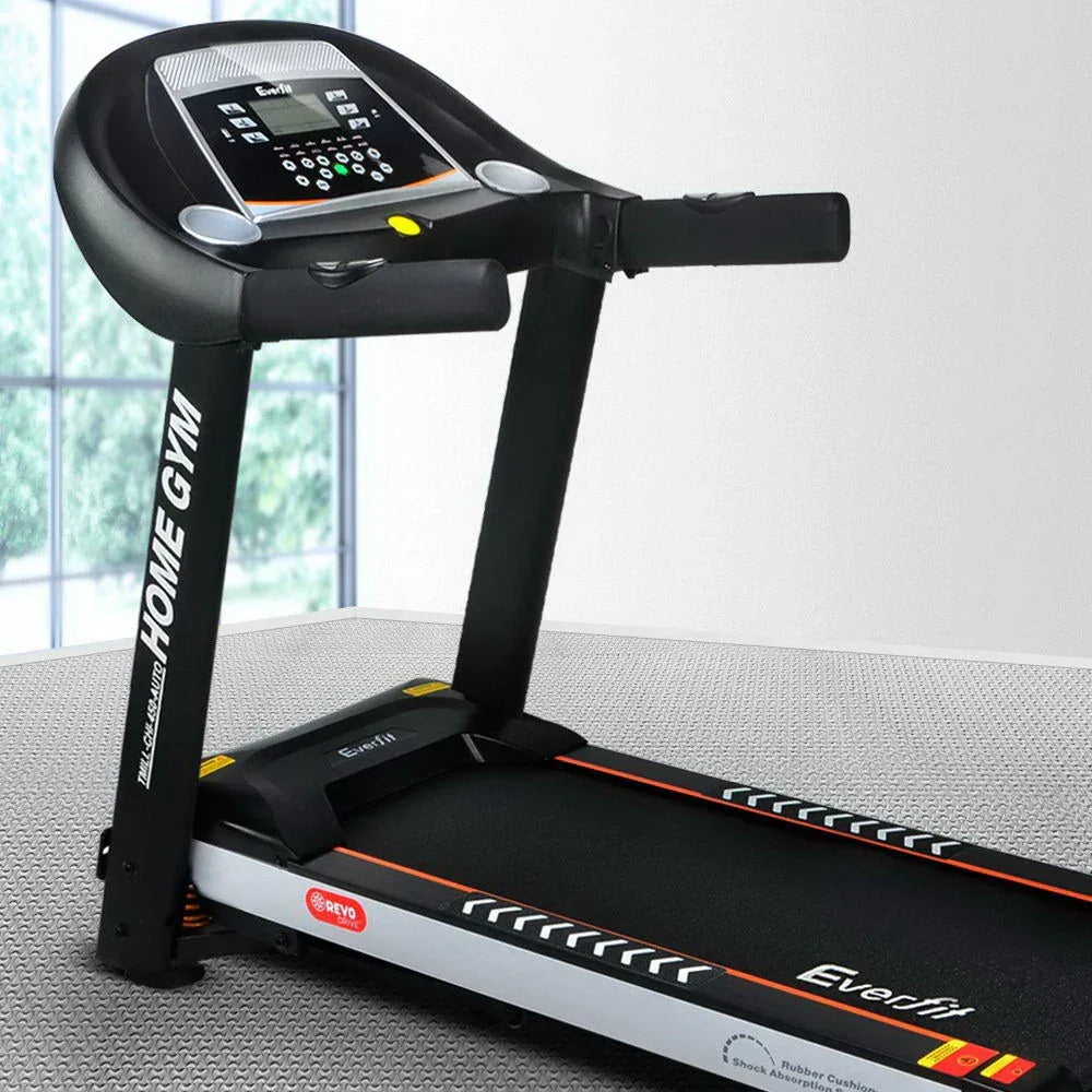 Treadmill running surface illuminated by natural light in minimalist room.