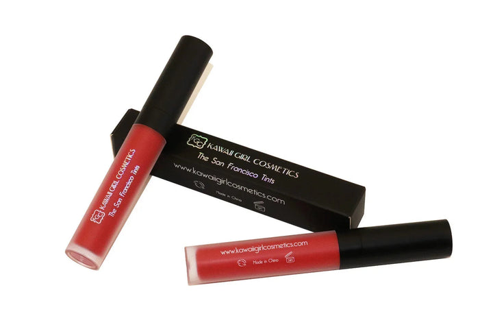 The Mission Tint makeup product in bold red shade, perfect for lips and cheeks, shown in vibrant lipstick and blush