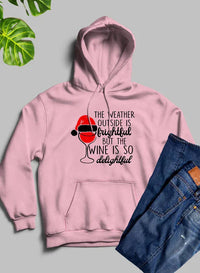 Black hoodie displayed flat showing winter-themed graphic and text on front with adjustable hood.