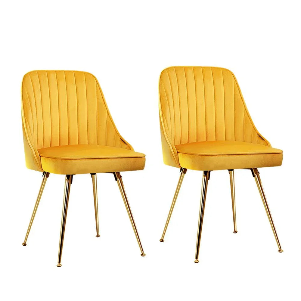 Two retro-style Artiss dining chairs with scalloped velvet back and gold metal legs in a modern kitchen setting.