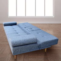 Grey sofa bed fully extended into bed with pull-down cupholder visible.