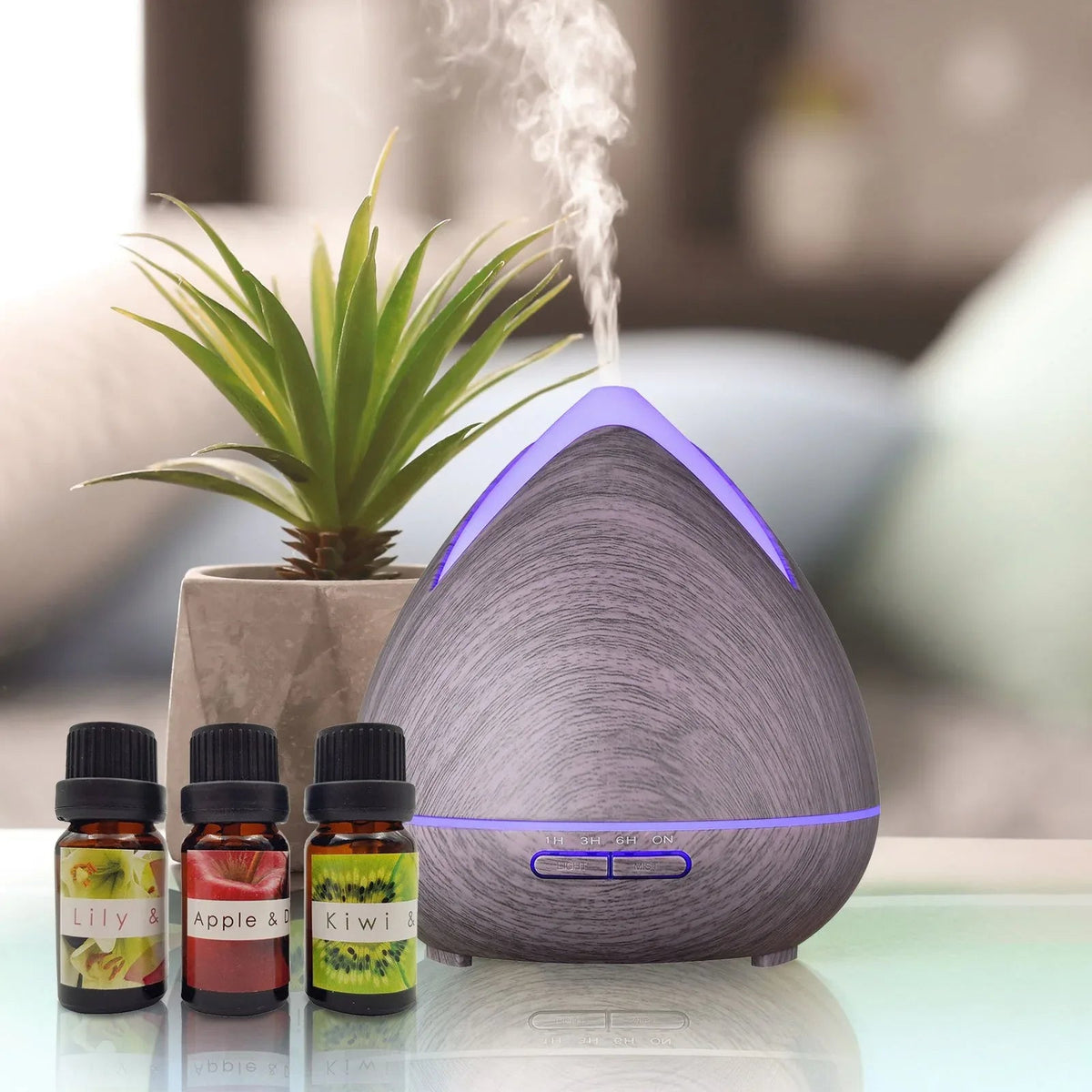 Close-up of diffuser top with cool mist rising against soft natural background.