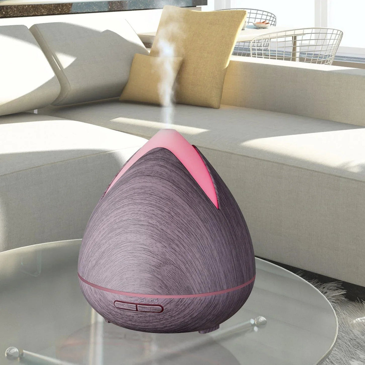 Diffuser emitting mist next to a small bowl of essential oil on a tabletop.