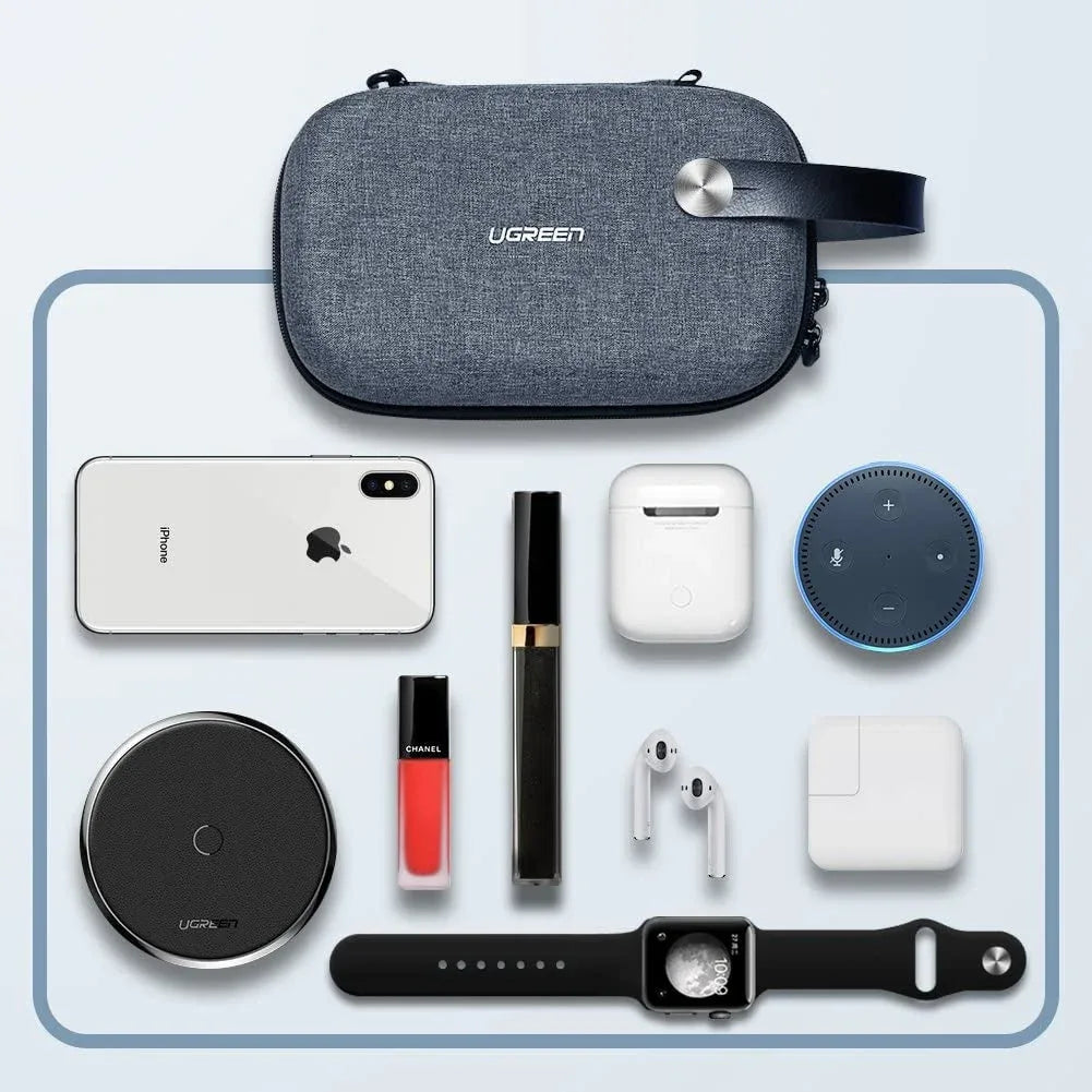 Top view of UGREEN travel bag displaying adjustable compartments holding tech accessories neatly.