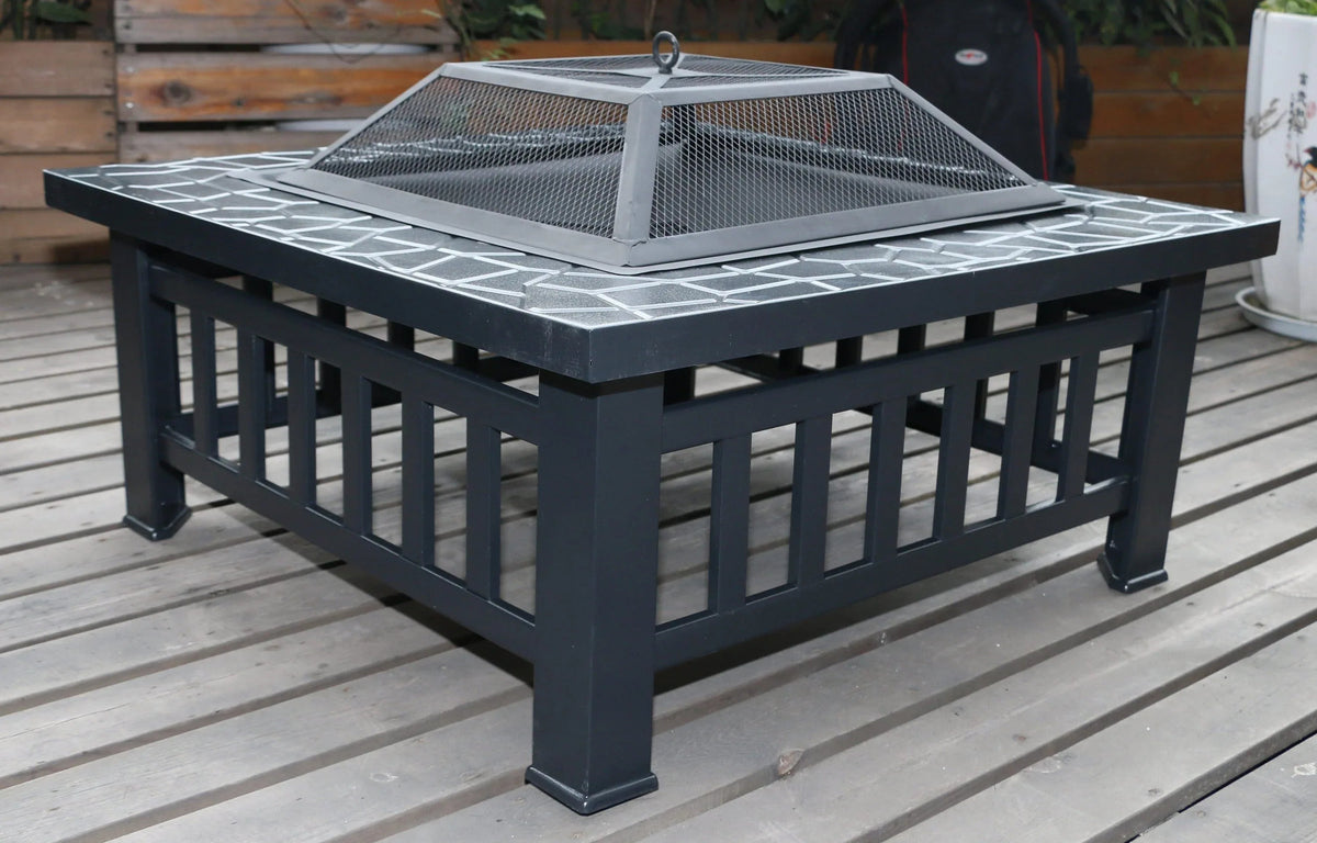 Square metal fire pit with a faux-stone finish on a wooden deck.
