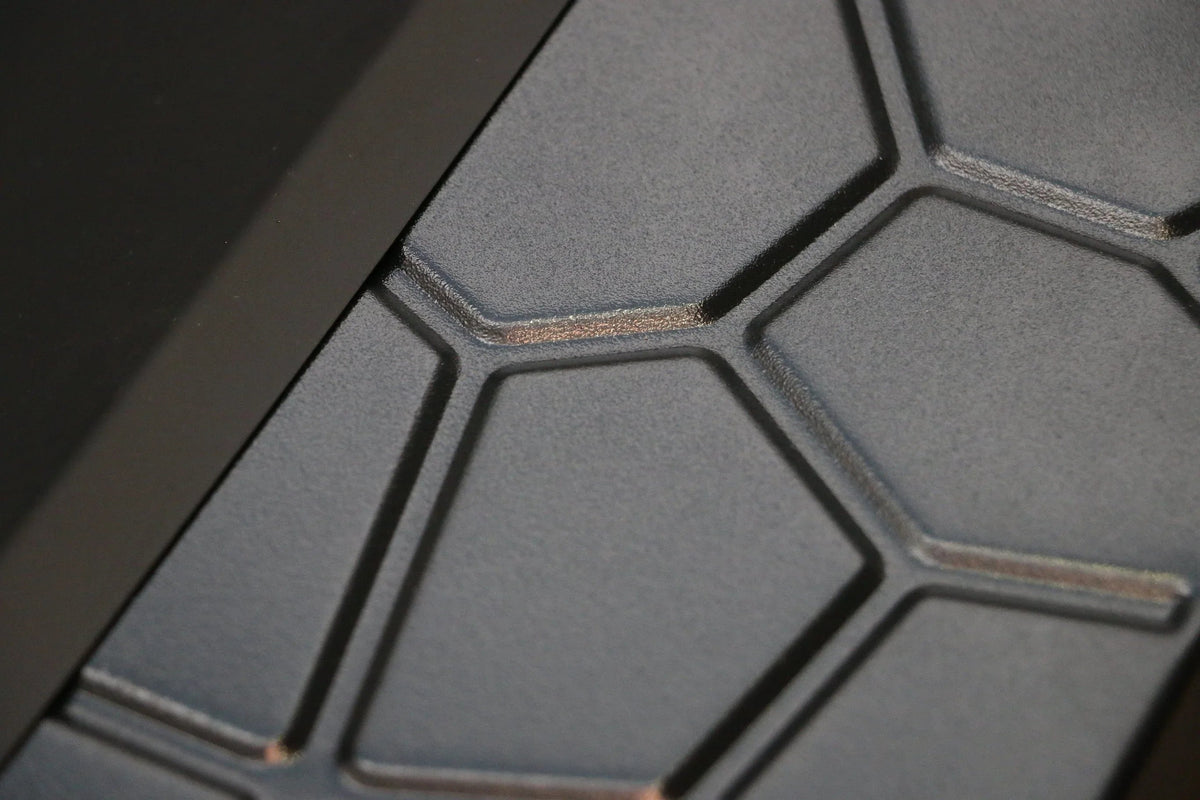 Side view of square metal fire pit highlighting its sturdy support posts.