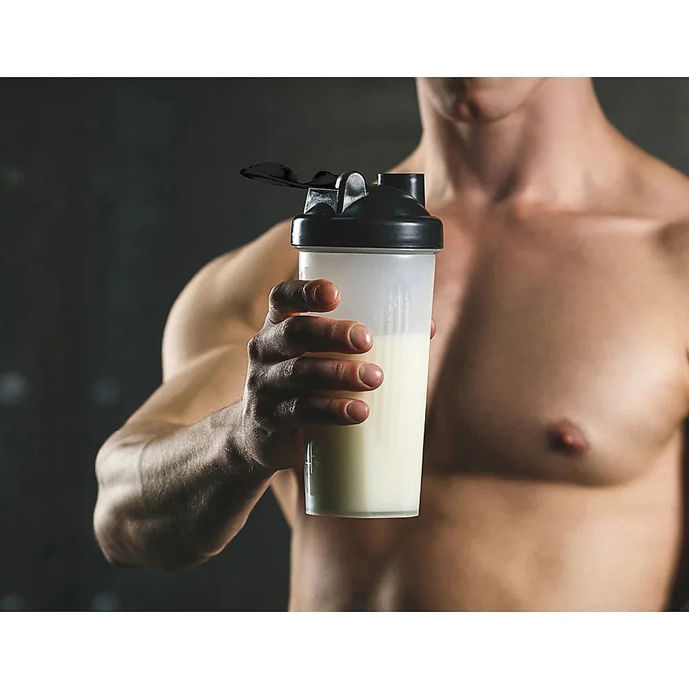 Close-up of protein shaker bottles filled with chocolate shake on a white background
