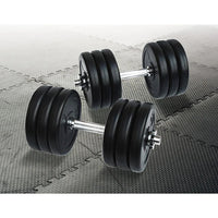 Close-up of adjustable dumbbell showing metal handle and black weight plates stacked.