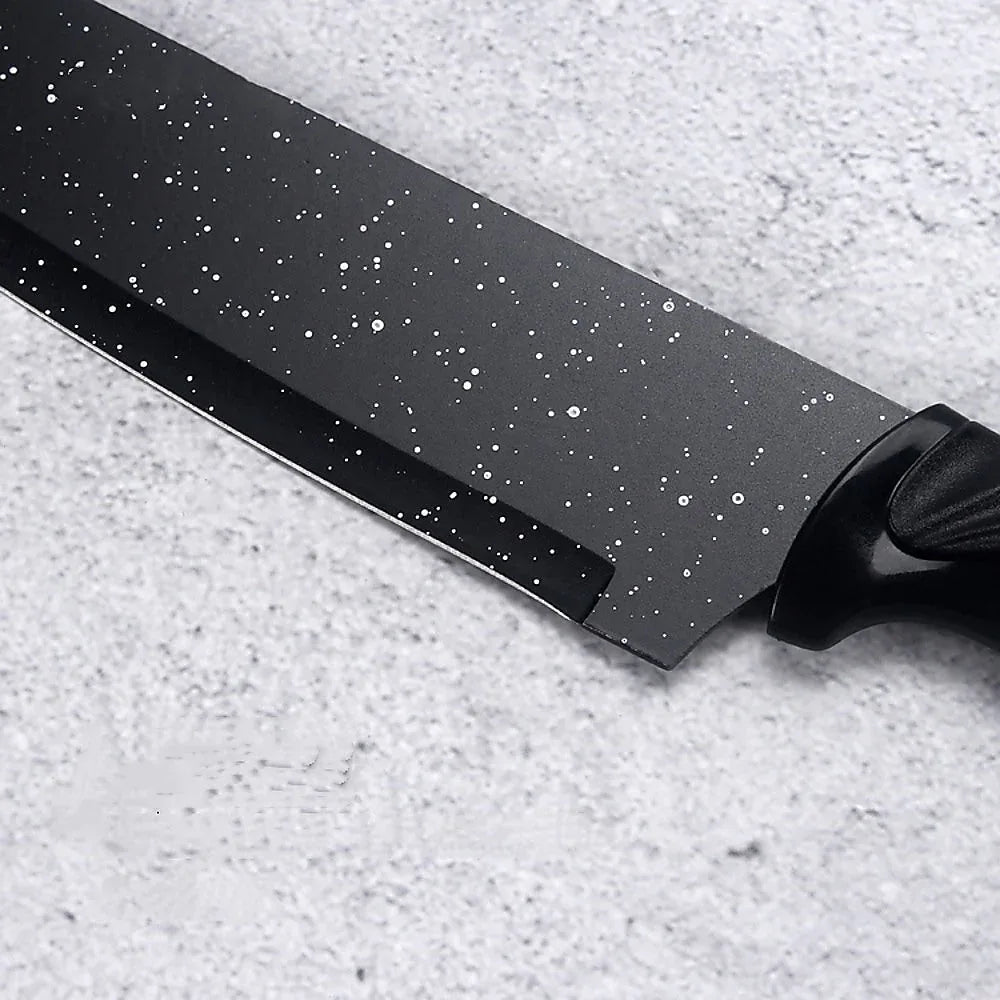 Close-up of kitchen scissors included in the kitchen 17-piece knife set with black handles.