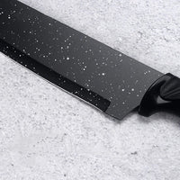 Close-up of kitchen scissors included in the kitchen 17-piece knife set with black handles.