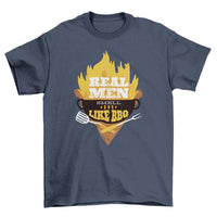 Black T-shirt with a BBQ grill illustration, flames, and text 'Real Men smell like bbq' in white.