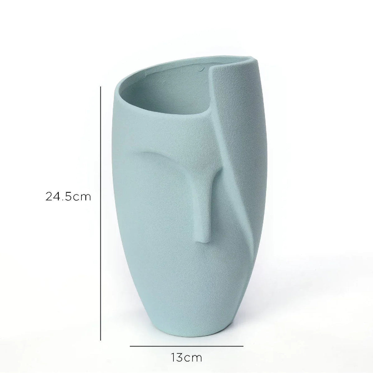 Close-up of white ceramic face planter showing detailed facial features, clean and smooth finish.