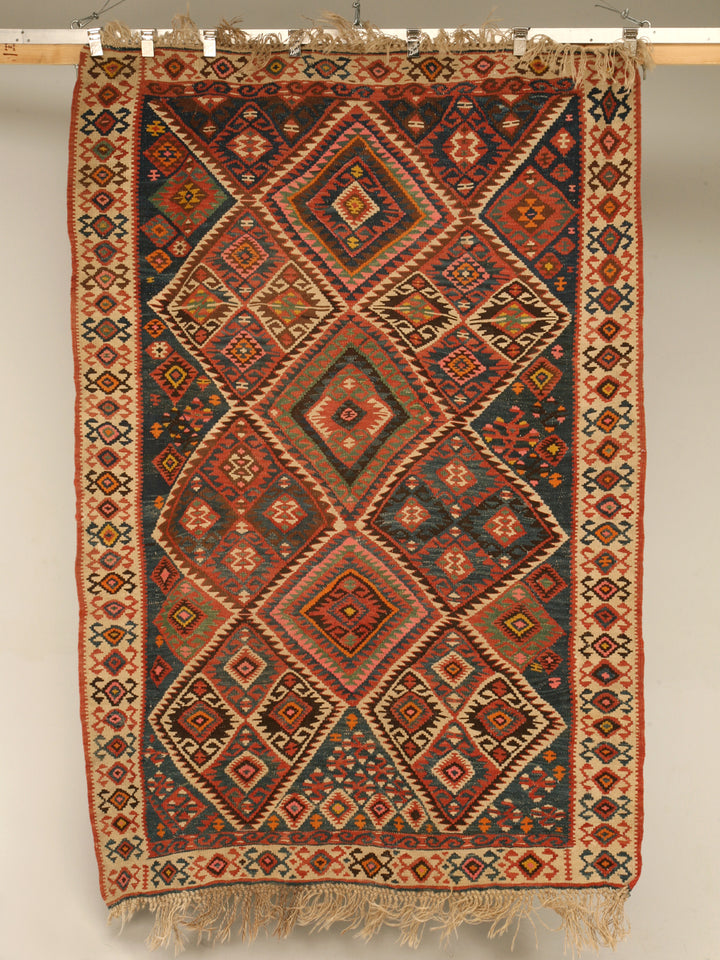 Handwoven kilim texture — representative example (photo: Cllane4, Wikimedia Commons, CC BY-SA)